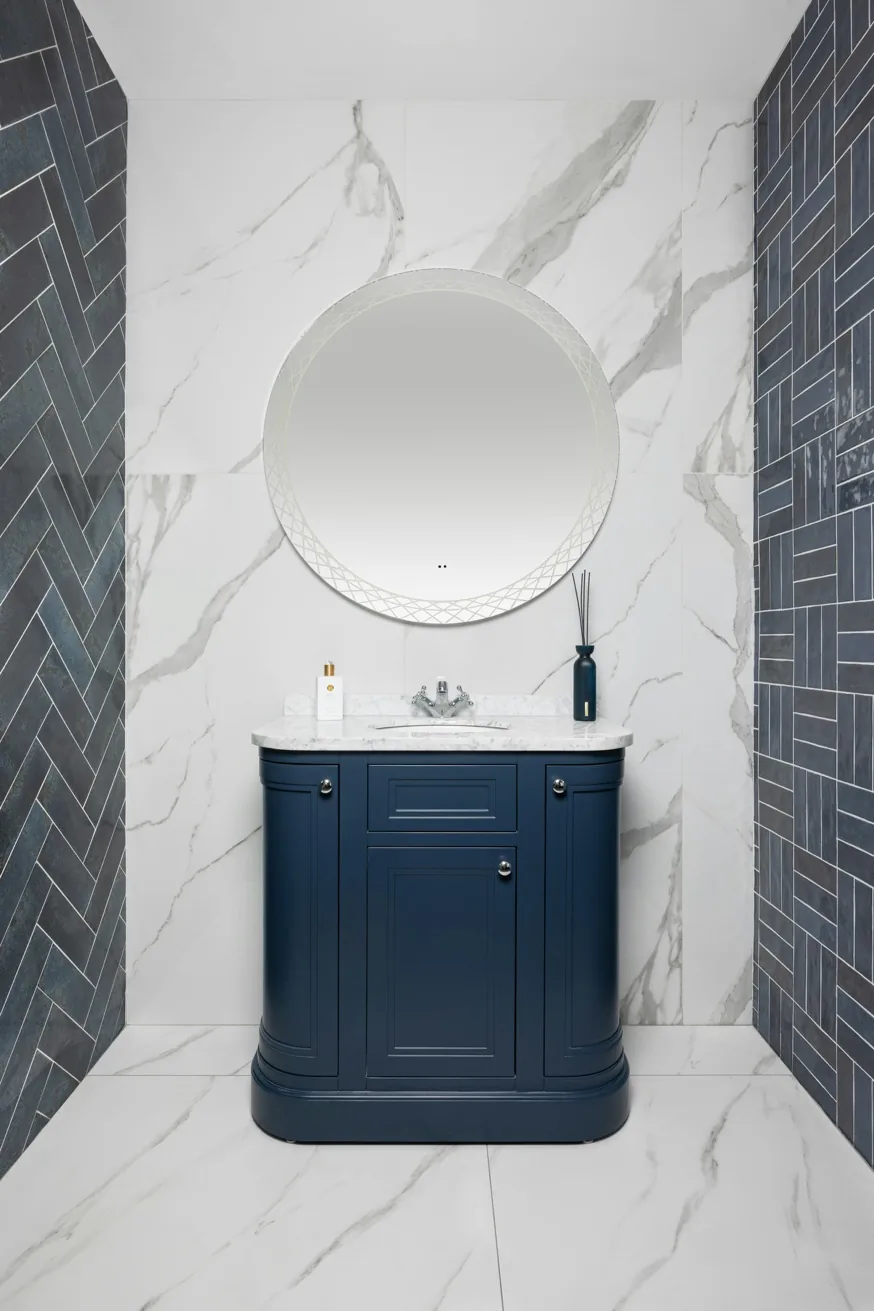 Custom bathroom vanity with marble countertop and refined brass fixtures