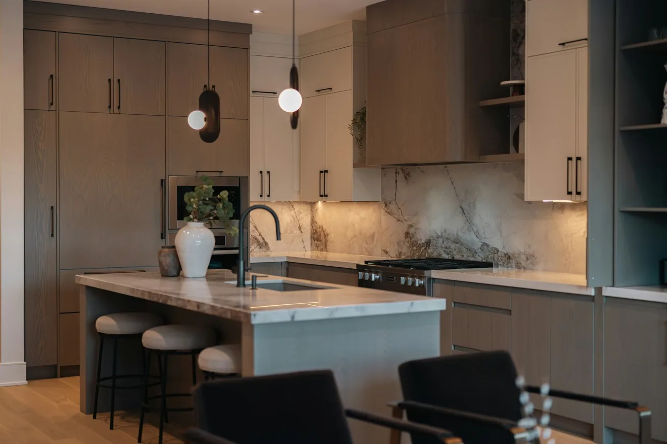 Custom kitchen featuring a dramatic full-height marble backsplash