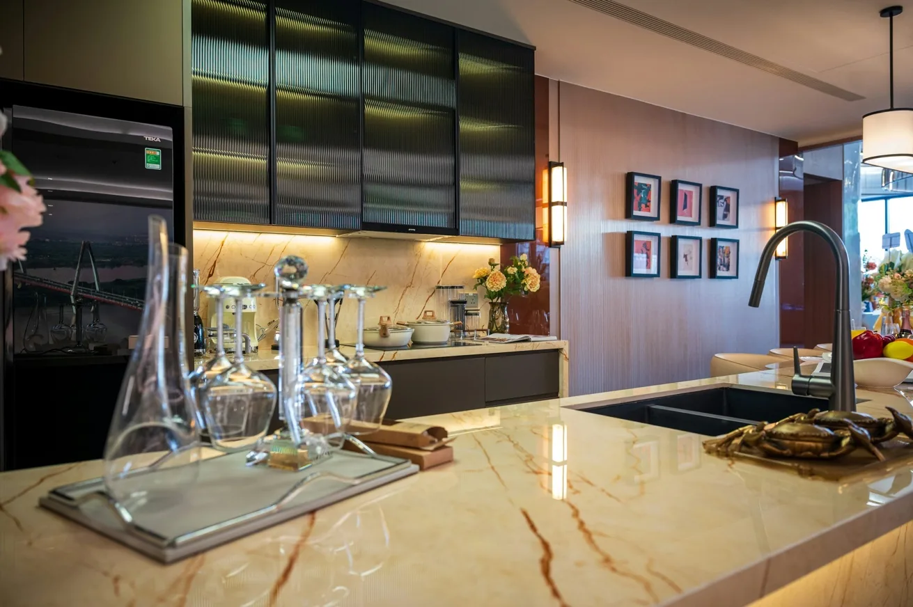 High-end kitchen with dramatic cabinetry, marble island and tailored finishes