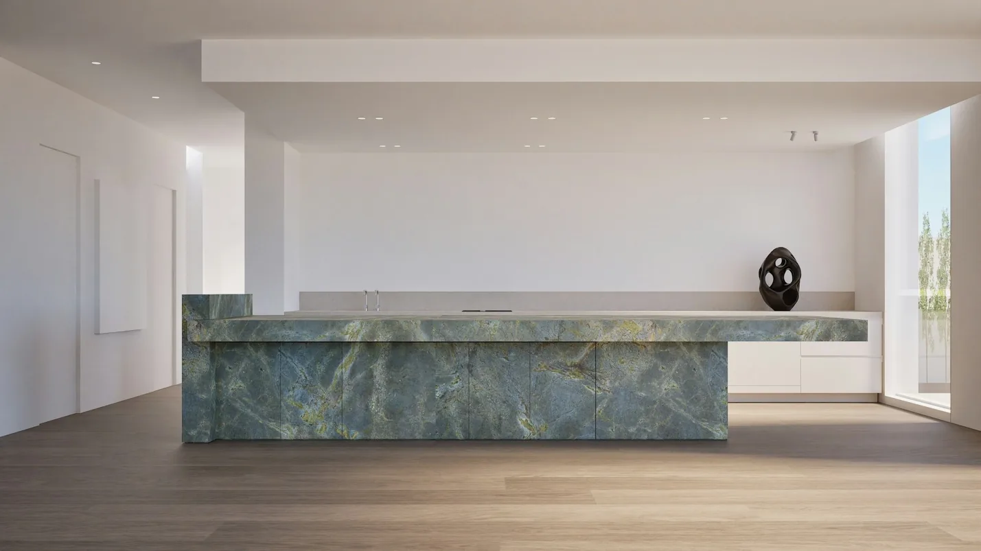 Luxury kitchen island showcasing a substantial marble countertop and custom cabinetry