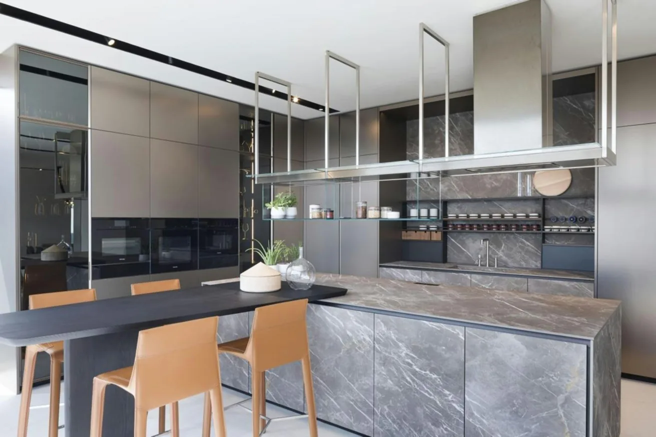 Elegant open kitchen with marble island and carefully planned dining connection