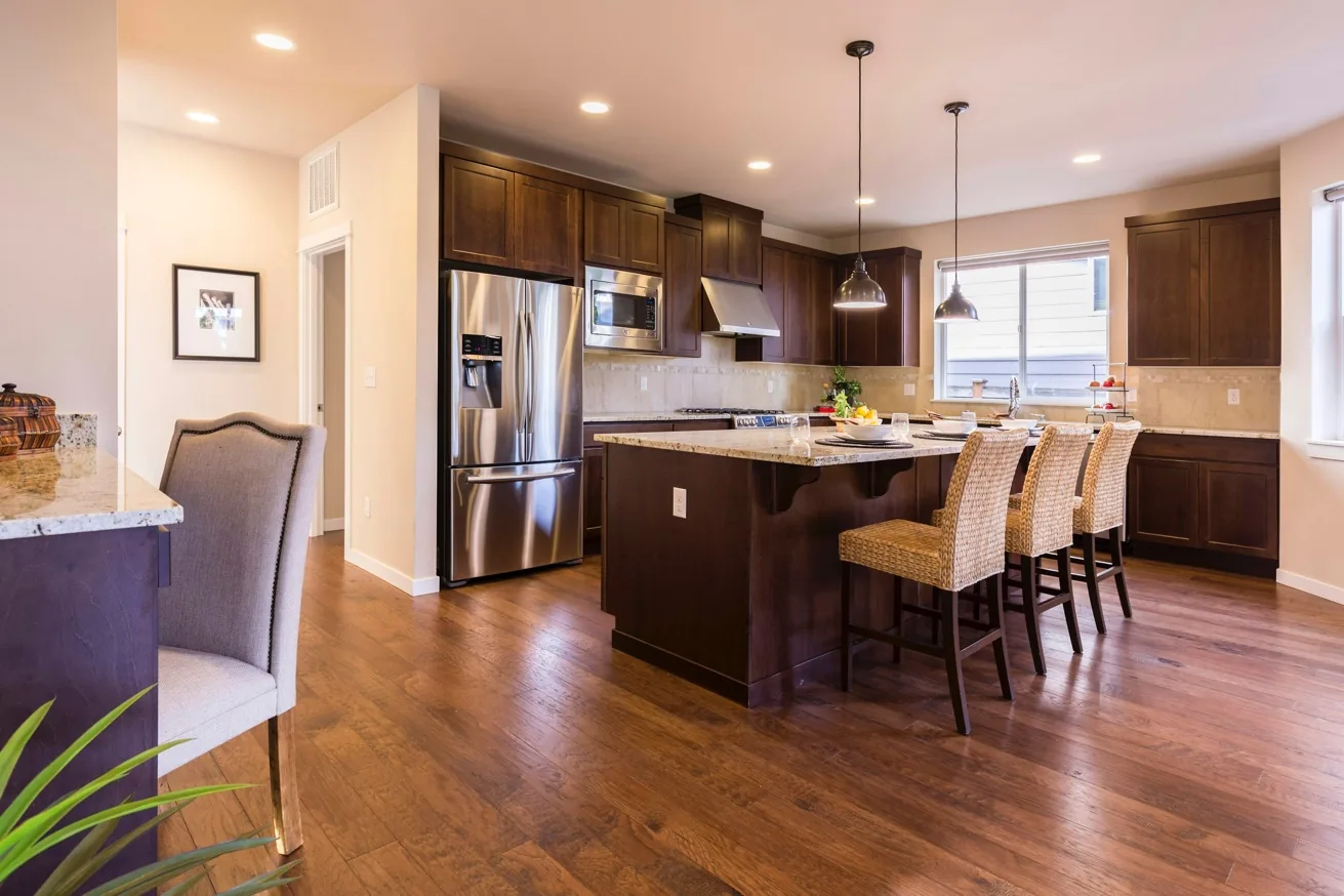 Warm wood kitchen interior with classic cabinetry and hardwood flooring