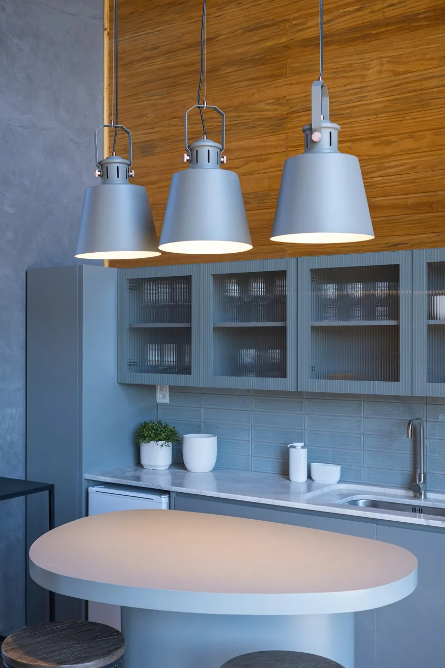 Statement pendant lighting illuminating an elegant custom kitchen